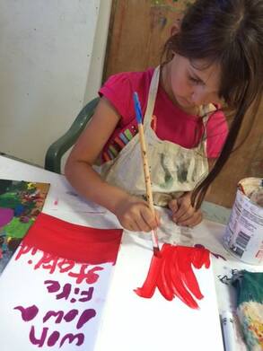 Picture of kid painting at workshop